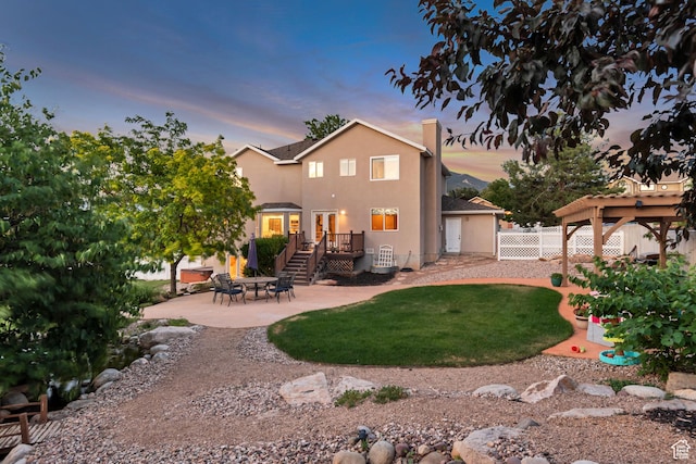 14012 S Osborne Ln E, Draper, UT 84020 - back of house with a patio area, a wooden deck, and stucco siding