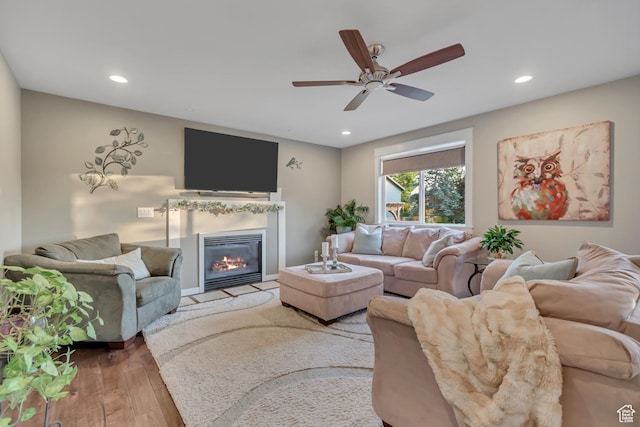 14012 S Osborne Ln E, Draper, UT 84020 - living room with a glass covered fireplace, hardwood / wood-style flooring, recessed lighting, and a ceiling fan