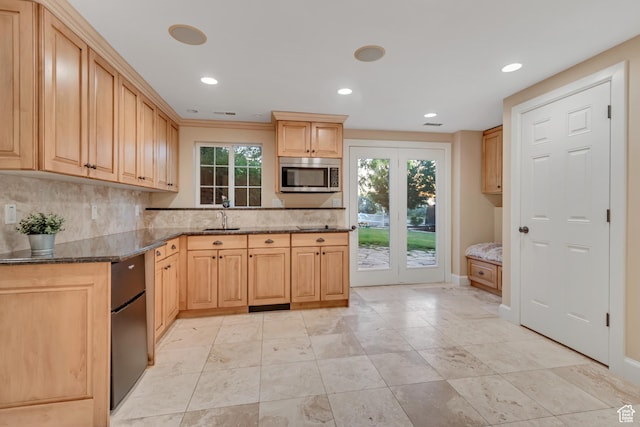 14012 S Osborne Ln E, Draper, UT 84020 - kitchen featuring stainless steel microwave, plenty of natural light, backsplash, dark stone counters, and recessed lighting