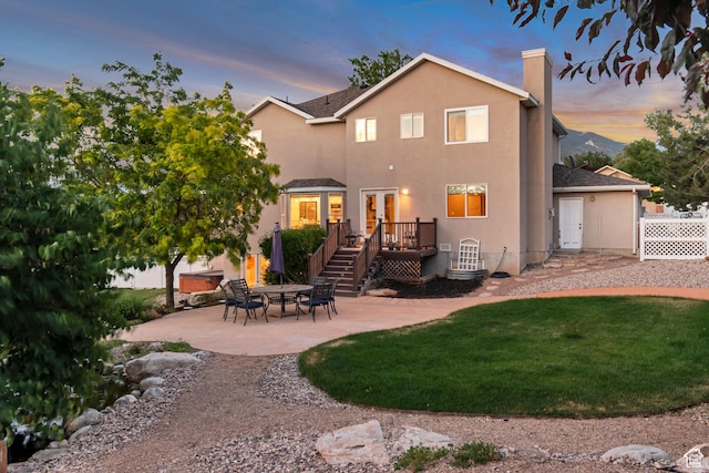14012 S Osborne Ln E, Draper, UT 84020 - rear view of house featuring a wooden deck, a patio, a yard, a chimney, and french doors