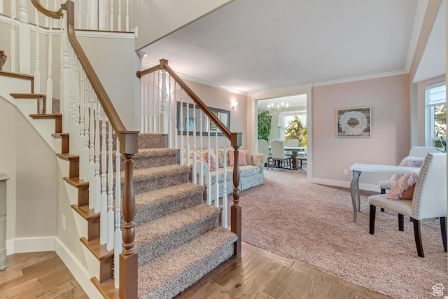 14012 S Osborne Ln E, Draper, UT 84020 - stairway featuring crown molding, wood finished floors, and a chandelier