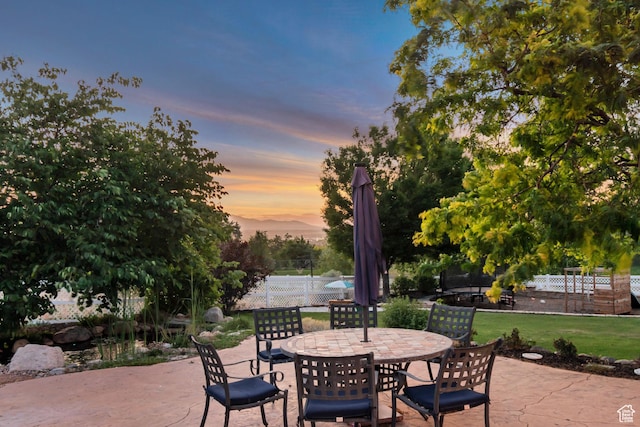 14012 S Osborne Ln E, Draper, UT 84020 - patio terrace at dusk with a patio and outdoor dining space
