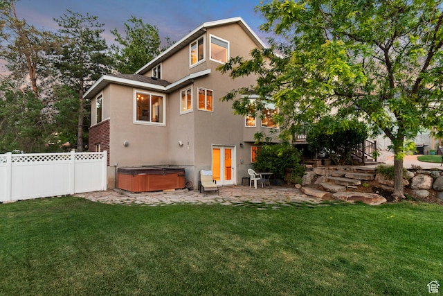 14012 S Osborne Ln E, Draper, UT 84020 - back of property with a hot tub, a patio, and stucco siding