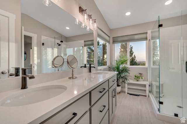 14012 S Osborne Ln E, Draper, UT 84020 - full bathroom featuring double vanity, a shower stall, vaulted ceiling, recessed lighting, and tile patterned floors
