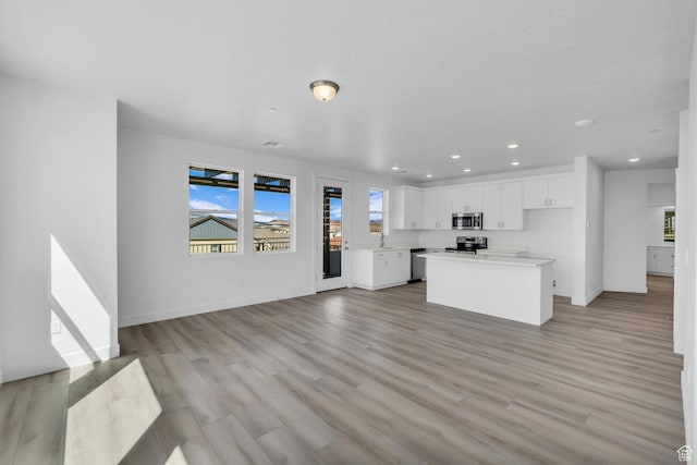 5599 S Carnelian Pkwy Unit 205, St George, UT 84790 - unfurnished living room featuring recessed lighting and light wood-style flooring