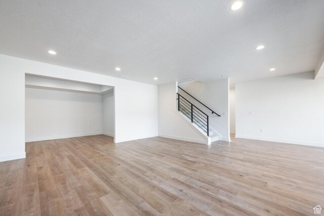 424 W Ascent Dr Unit 254, Hideout, UT 84036 - finished below grade area featuring stairway, recessed lighting, and light wood-style flooring