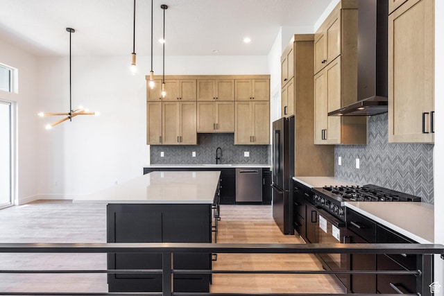 424 W Ascent Dr Unit 254, Hideout, UT 84036 - kitchen featuring wall chimney range hood, freestanding refrigerator, dishwasher, stove, and light wood finished floors