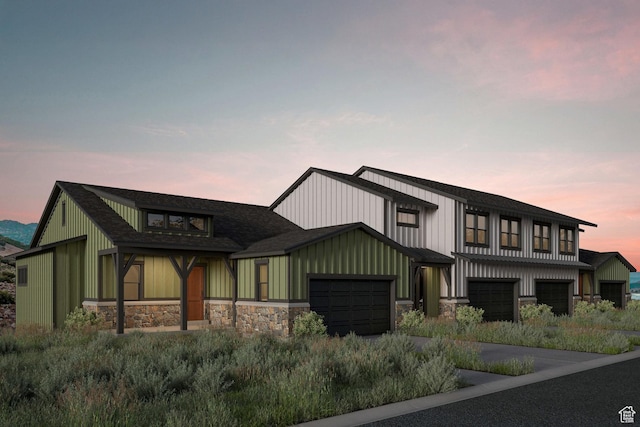 424 W Ascent Dr Unit 254, Hideout, UT 84036 - view of front of property featuring stone siding, a garage, board and batten siding, and driveway