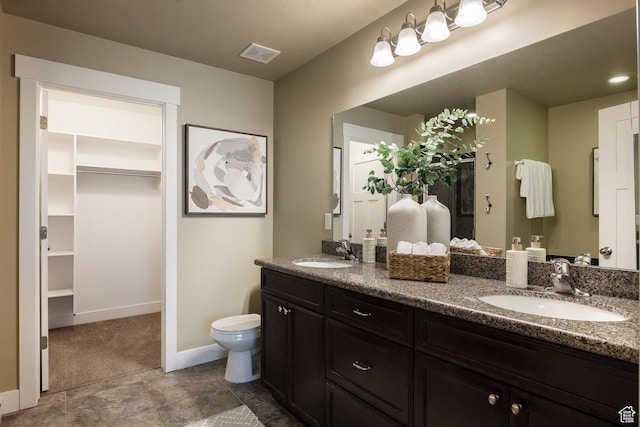 7902 S Farm House Ln E, Midvale, UT 84047 - bathroom with double vanity and a walk in closet