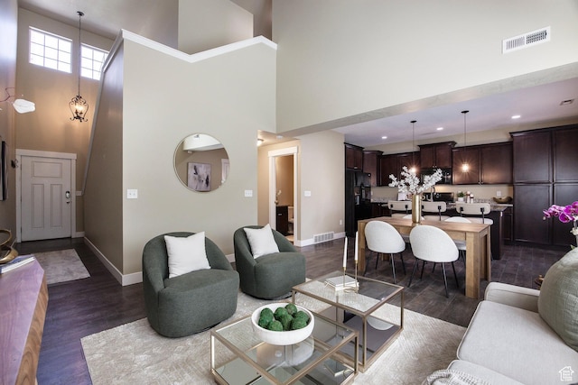 7902 S Farm House Ln E, Midvale, UT 84047 - living room featuring a high ceiling, dark wood-style flooring, and recessed lighting