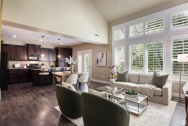 7902 S Farm House Ln E, Midvale, UT 84047 - living room with dark wood-type flooring and high vaulted ceiling