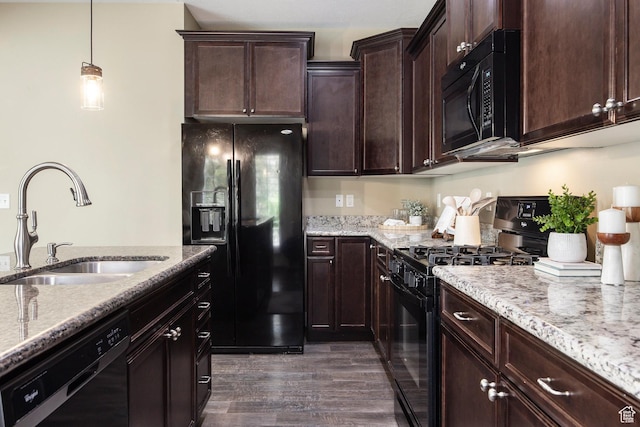 7902 S Farm House Ln E, Midvale, UT 84047 - kitchen featuring black appliances, light stone countertops, and dark wood-style flooring