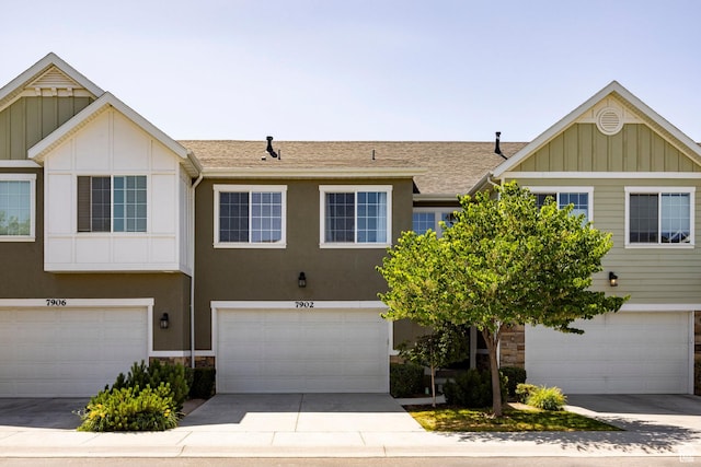 7902 S Farm House Ln E, Midvale, UT 84047 - multi unit property featuring board and batten siding, an attached garage, and driveway
