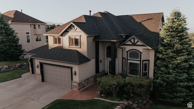 1628 E Lone Oak Dr, Draper, UT 84020 - view of front of property featuring stone siding, stucco siding, a shingled roof, and concrete driveway
