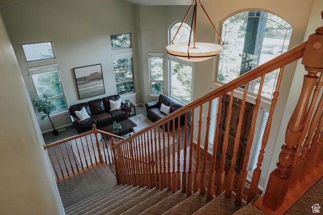 1628 E Lone Oak Dr, Draper, UT 84020 - staircase featuring carpet and a towering ceiling