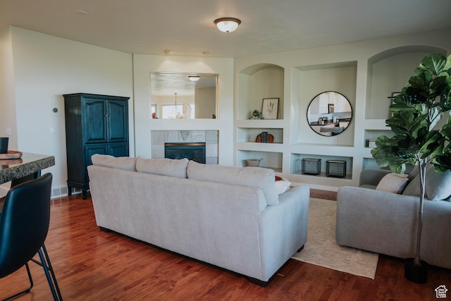 1628 E Lone Oak Dr, Draper, UT 84020 - living area featuring built in shelves, a fireplace, and dark wood finished floors