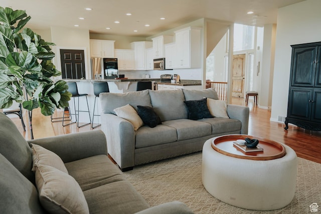 1628 E Lone Oak Dr, Draper, UT 84020 - living area featuring light wood-style floors and recessed lighting