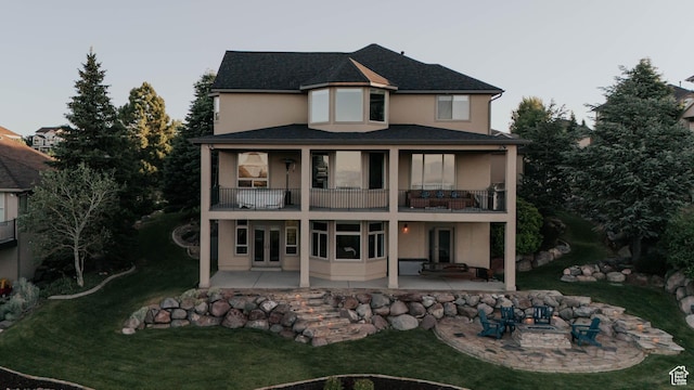 1628 E Lone Oak Dr, Draper, UT 84020 - rear view of property with a balcony, a patio area, stucco siding, and a lawn