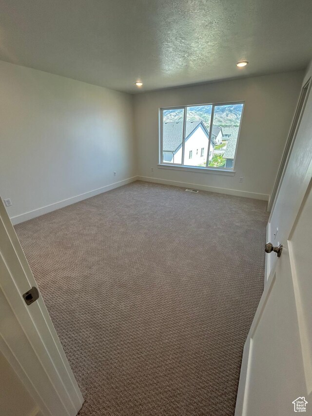 556 N 800 W, Smithfield, UT 84335 - carpeted empty room featuring recessed lighting and a textured ceiling