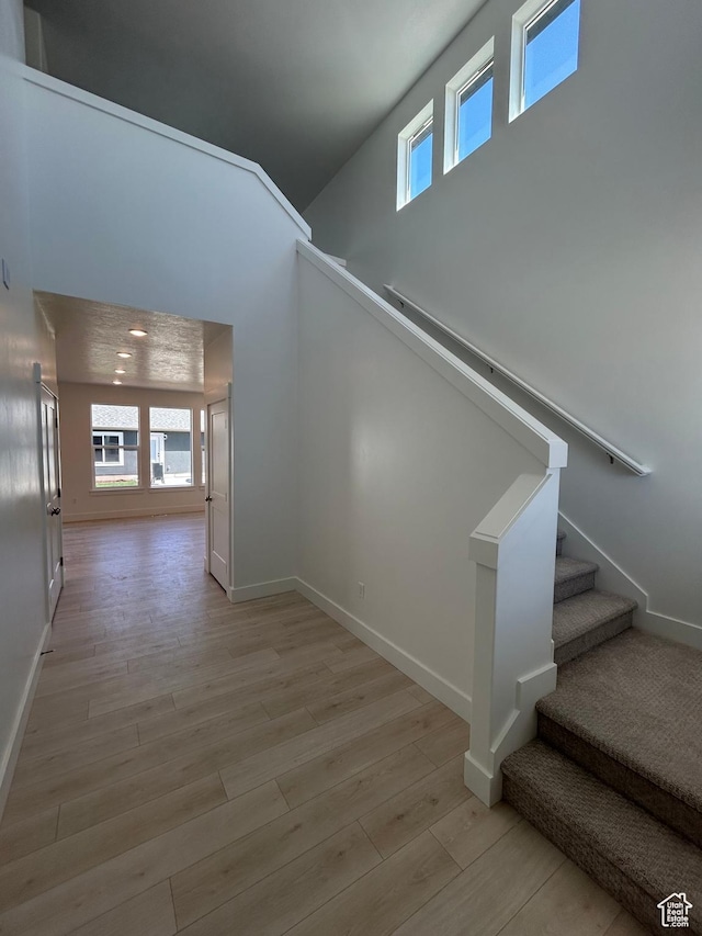 556 N 800 W, Smithfield, UT 84335 - stairway with wood finished floors and a towering ceiling
