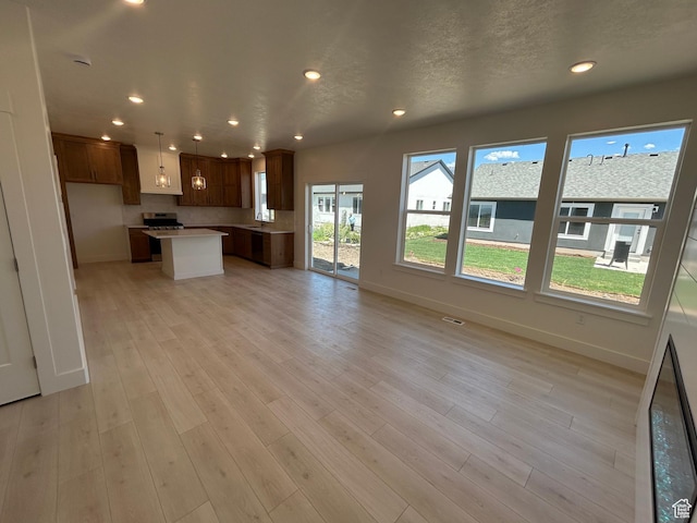 556 N 800 W, Smithfield, UT 84335 - kitchen featuring open floor plan, recessed lighting, a kitchen island, light wood finished floors, and light countertops