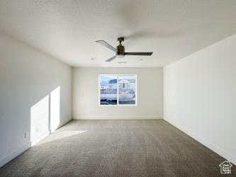 1805 N 70 W, Tooele, UT 84074 - carpeted spare room with ceiling fan