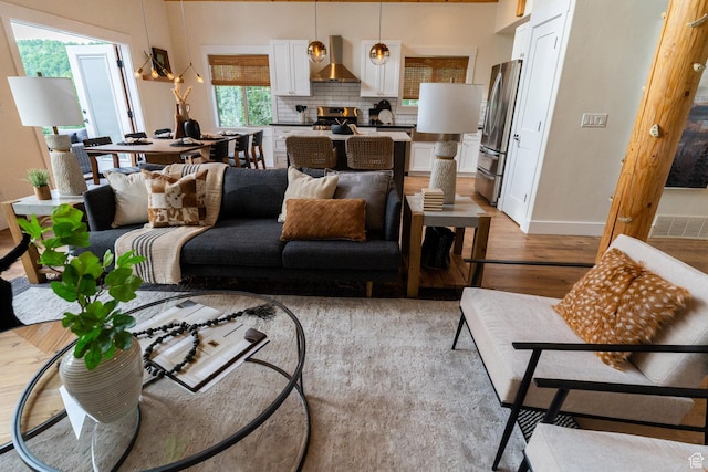 2143 S Aspen Cir, Wanship, UT 84017 - living room featuring light wood finished floors and baseboards