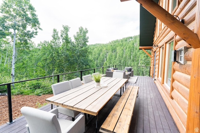 2143 S Aspen Cir, Wanship, UT 84017 - wooden deck featuring a view of trees and outdoor dining space