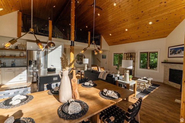 2143 S Aspen Cir, Wanship, UT 84017 - dining room featuring wooden ceiling, high vaulted ceiling, wood finished floors, recessed lighting, and a fireplace