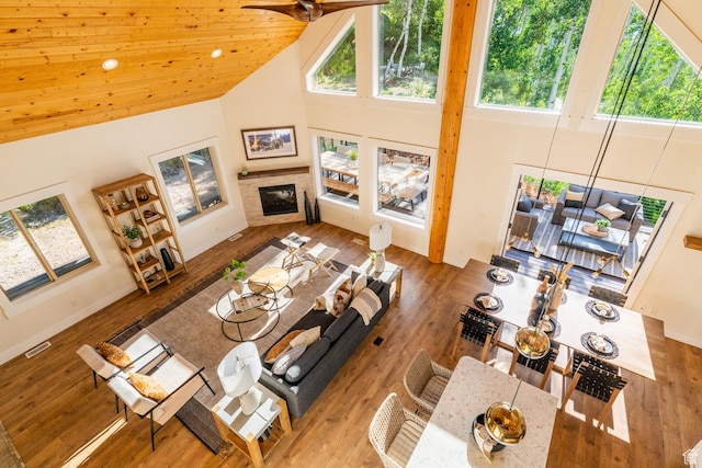 2143 S Aspen Cir, Wanship, UT 84017 - living room featuring high vaulted ceiling, a glass covered fireplace, wood finished floors, and ceiling fan