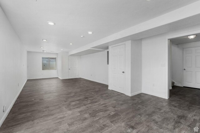 4004 N Shelter Cv W, Lehi, UT 84043 - unfurnished living room featuring dark wood-style floors and recessed lighting