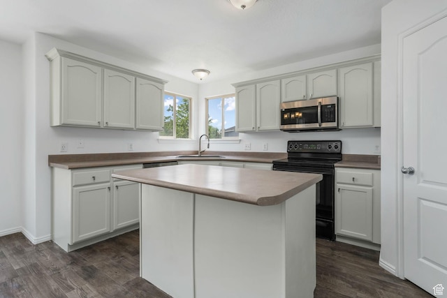 4004 N Shelter Cv W, Lehi, UT 84043 - kitchen with stainless steel microwave, black / electric stove, dark wood finished floors, and a kitchen island