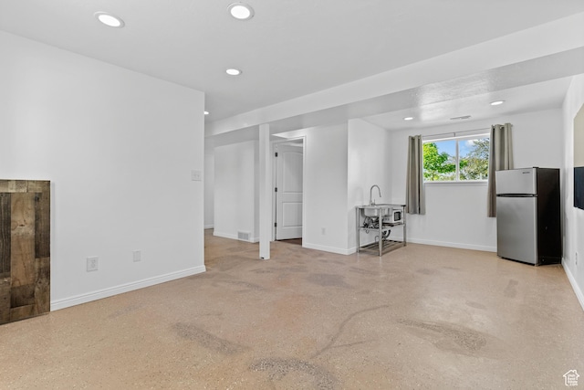 2124 W 7125 S, West Jordan, UT 84084 - unfurnished living room featuring baseboards and recessed lighting