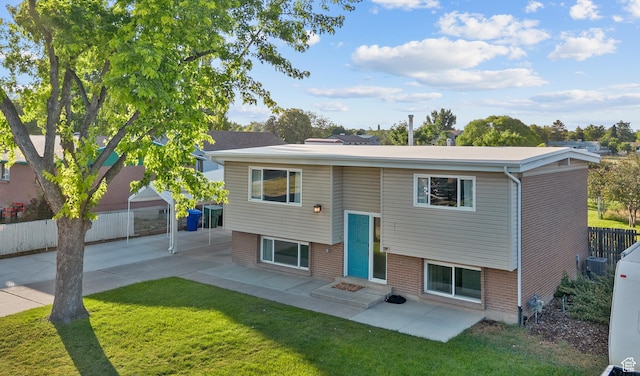 2124 W 7125 S, West Jordan, UT 84084 - raised ranch featuring brick siding, a patio area, and entry steps