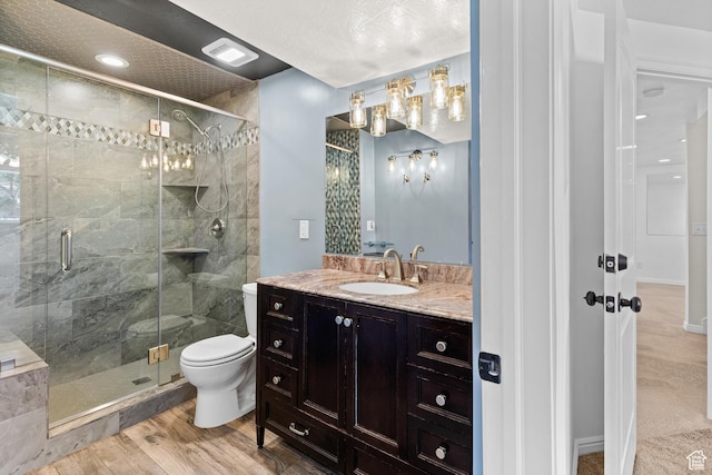 2124 W 7125 S, West Jordan, UT 84084 - bathroom with a shower stall, vanity, and wood finished floors