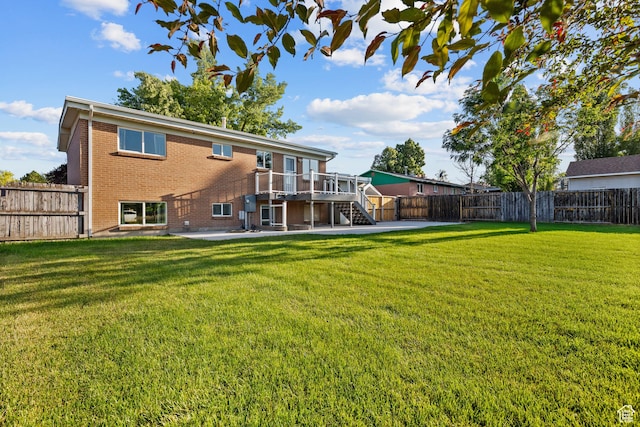 2124 W 7125 S, West Jordan, UT 84084 - back of house with brick siding, stairs, a fenced backyard, a patio area, and a deck