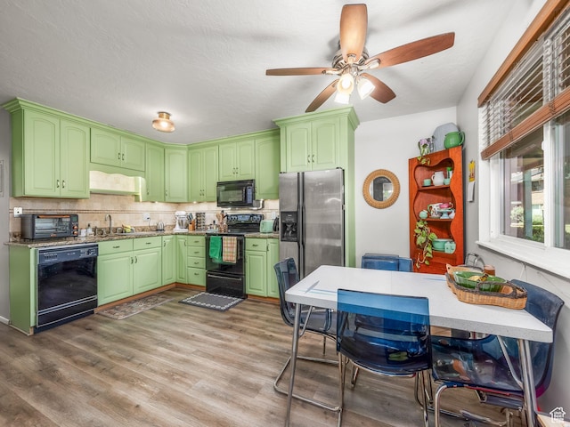 4742 S 700 E Unit 84, Salt Lake City, UT 84107 - kitchen with black appliances, ceiling fan, decorative backsplash, wood finished floors, and green cabinets
