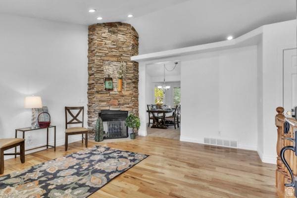 1342 S 1340 E, Spanish Fork, UT 84660 - living room featuring wood finished floors, a fireplace, recessed lighting, a chandelier, and lofted ceiling