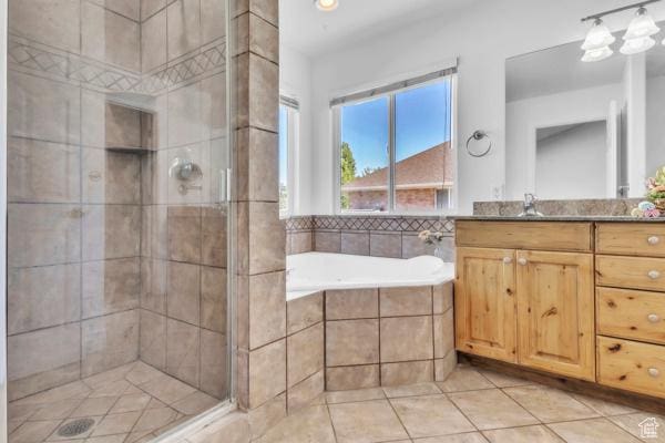1342 S 1340 E, Spanish Fork, UT 84660 - full bath featuring vanity, a shower stall, a garden tub, and tile patterned flooring