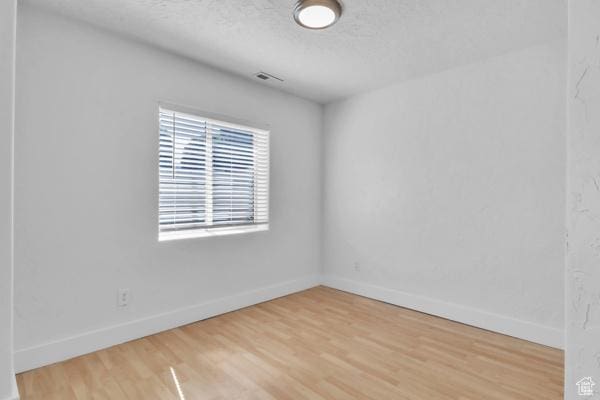 1342 S 1340 E, Spanish Fork, UT 84660 - spare room with light wood-type flooring and a textured ceiling