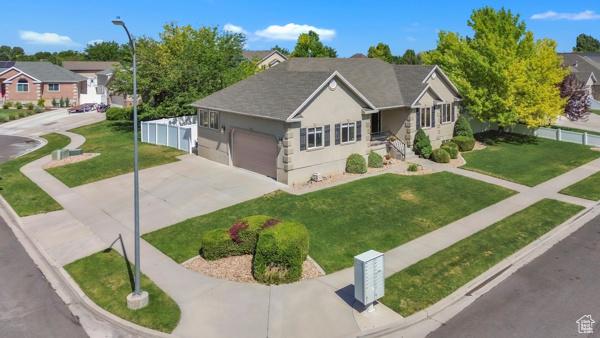 1342 S 1340 E, Spanish Fork, UT 84660 - ranch-style house featuring driveway, an attached garage, and stucco siding