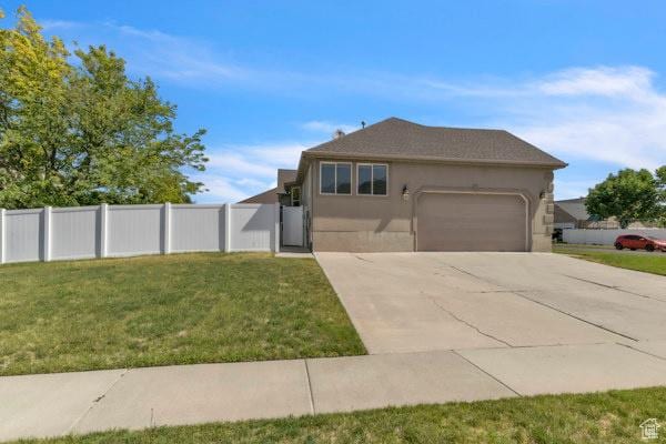 1342 S 1340 E, Spanish Fork, UT 84660 - view of front of house with a garage, driveway, and stucco siding