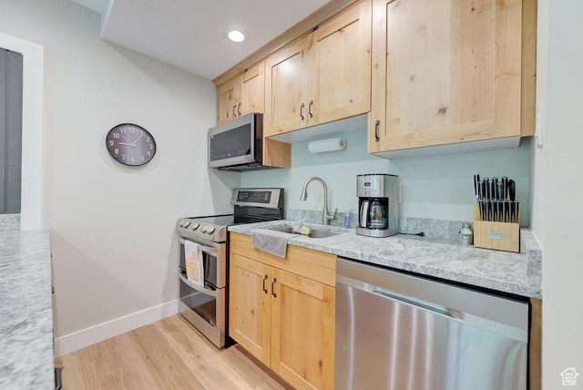 9202 E Lodge Dr Unit 201202, Snowbird, UT 84092 - kitchen with stainless steel appliances, light brown cabinetry, light wood-type flooring, and recessed lighting