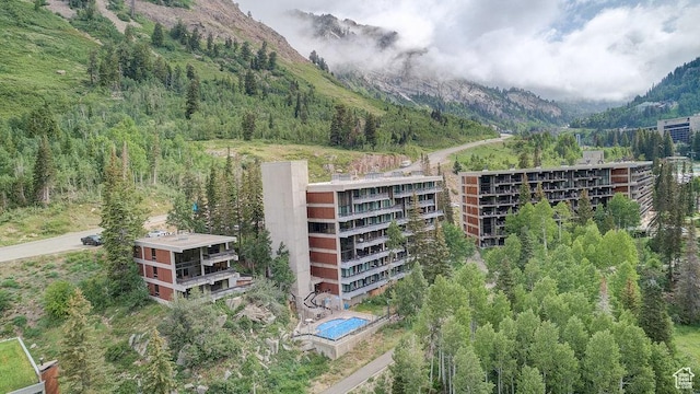 9202 E Lodge Dr Unit 201202, Snowbird, UT 84092 - view of building exterior featuring a mountain view and a view of trees