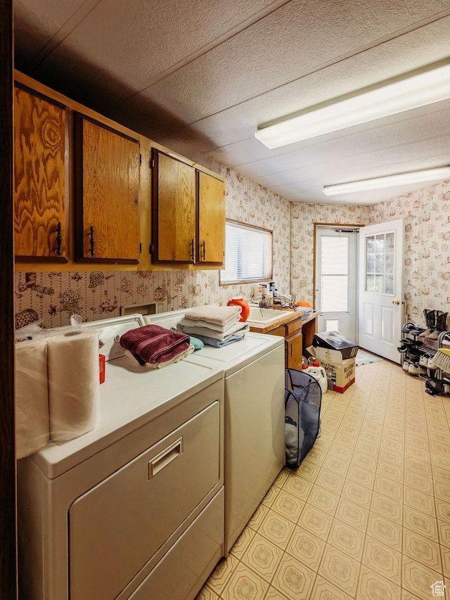 1633 W 2100 N, Helper, UT 84526 - washroom featuring wallpapered walls, cabinet space, washer and clothes dryer, and a textured ceiling