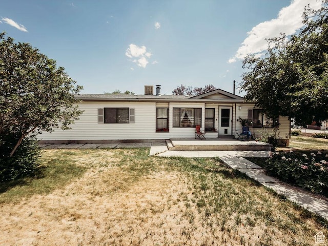 1633 W 2100 N, Helper, UT 84526 - rear view of property with a lawn and a patio area