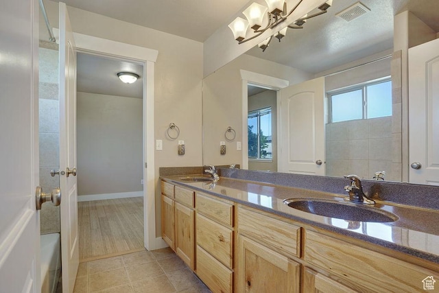 1541 N 25 E, Layton, UT 84041 - bathroom featuring double vanity, a chandelier, and tile patterned flooring