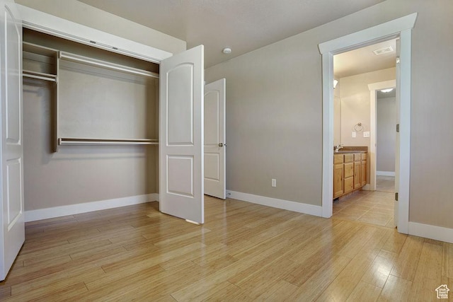 1541 N 25 E, Layton, UT 84041 - unfurnished bedroom with light wood-style floors and a closet