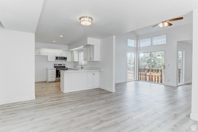 415 E Acoma Rd S, Midvale, UT 84047 - kitchen with stainless steel appliances, open floor plan, a ceiling fan, healthy amount of natural light, and recessed lighting