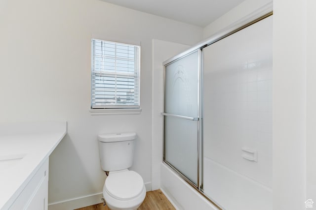 415 E Acoma Rd S, Midvale, UT 84047 - full bath with wood finished floors, vanity, and enclosed tub / shower combo